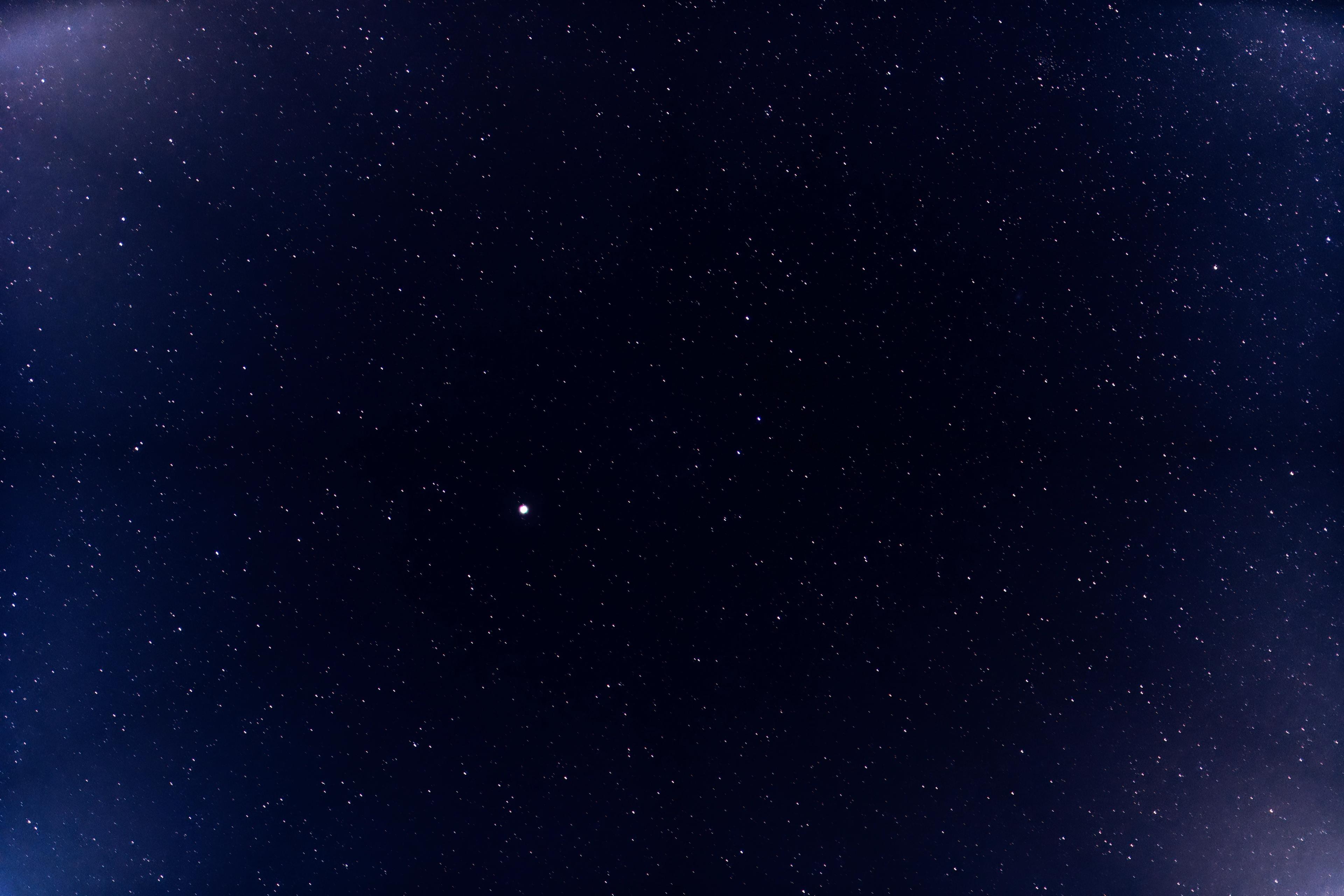 A random shot of a section of the night sky with a blue hue